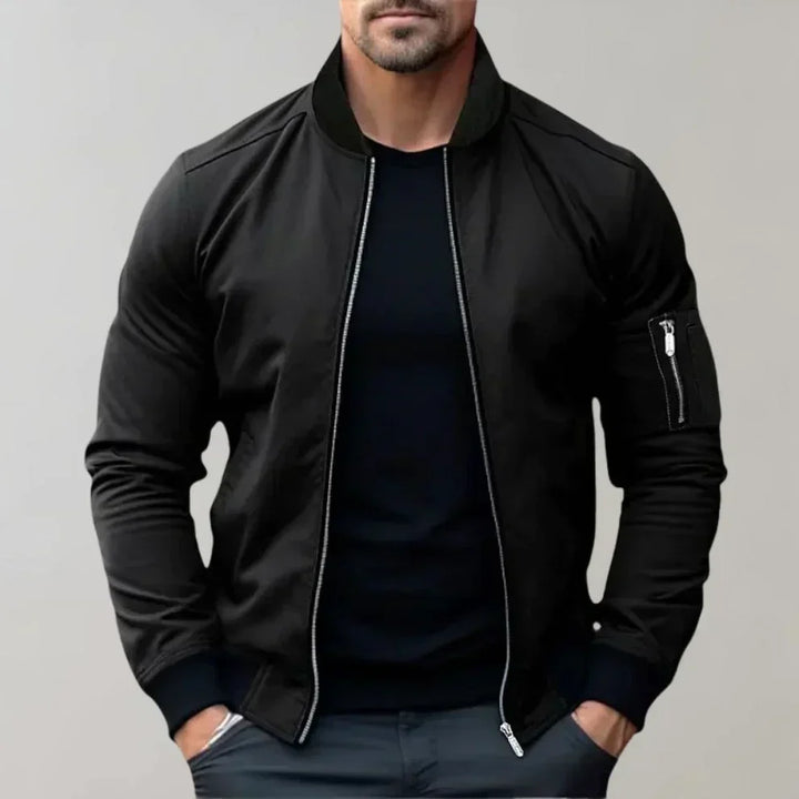 "Blouson bomber homme élégant bleu, style moderne, léger avec poches, parfait pour tenue décontractée et sorties urbaines."