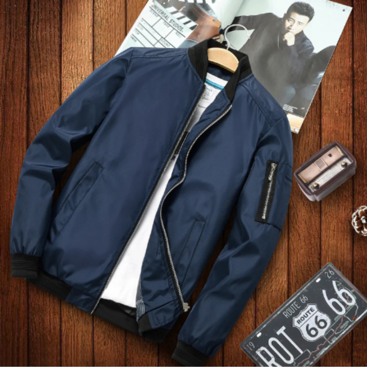 "Blouson bomber homme urbain, multi-poches, coupe-vent, en matière légère noir pour un look moderne et pratique."