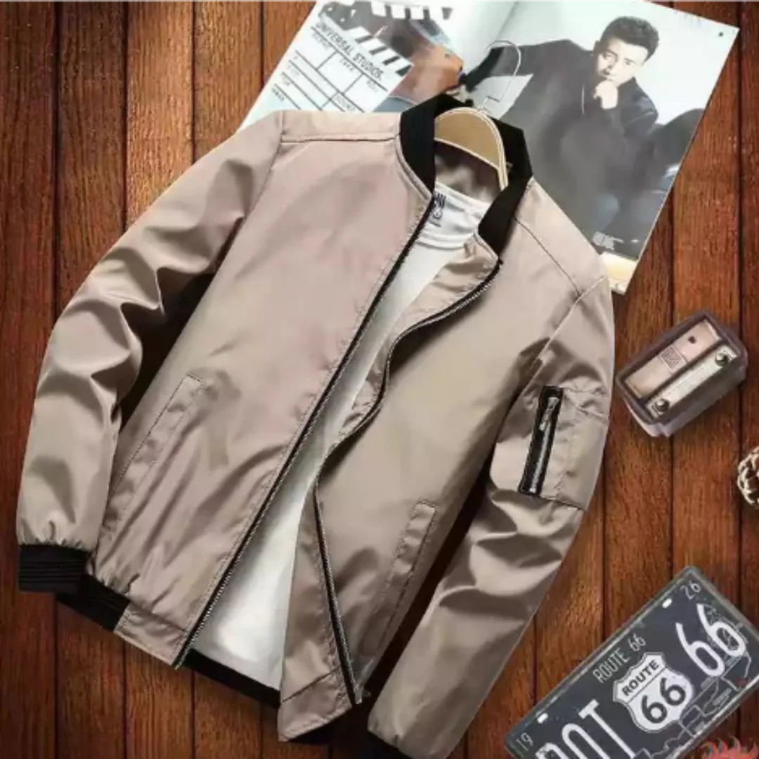 "Blouson bomber homme urbain, multi-poches, coupe-vent, en matière légère noir pour un look moderne et pratique."