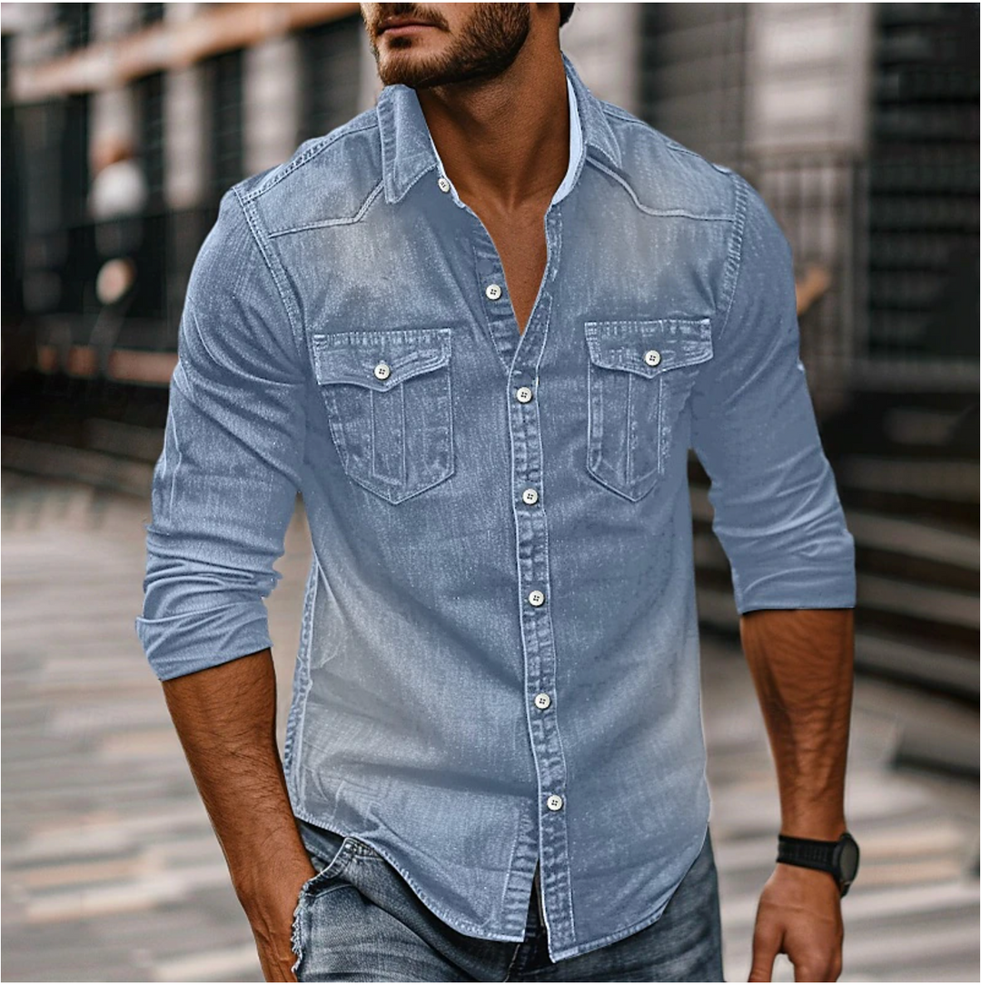 "Chemise homme en denim bleu avec col classique, fermeture à boutons et poches poitrine, élégante et résistante."