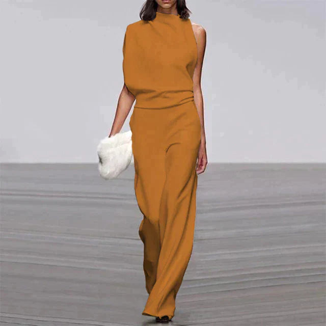 "Combinaison femme élégante sans manches, pantalon ample, tissu léger, disponible en couleurs vives, look sophistiqué."