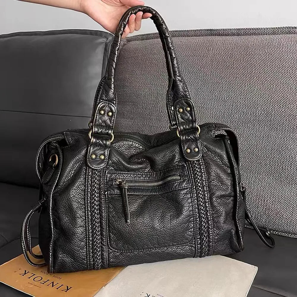 "Élégant sac à main noir en cuir véritable, chic et durable, idéal pour femmes, avec fermeture éclair et multiples compartime