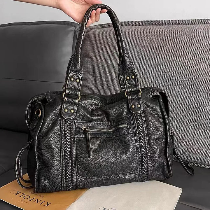 "Élégant sac à main noir en cuir véritable, chic et durable, idéal pour femmes, avec fermeture éclair et multiples compartime