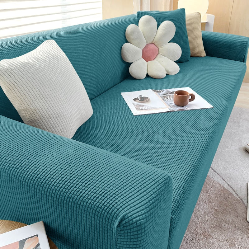 "Housse de canapé élastique beige chic, ajustement impeccable, protège et embellit divers styles de canapés."
