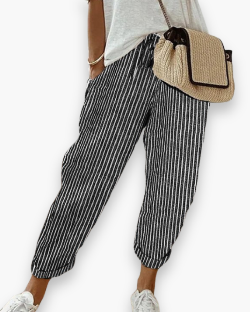 "Pantalon ample femme, tissu léger, style moderne, poches discrètes, taille élastique, coupe élégante, confort optimal"