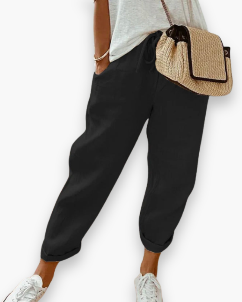 "Pantalon ample femme, tissu léger, style moderne, poches discrètes, taille élastique, coupe élégante, confort optimal"