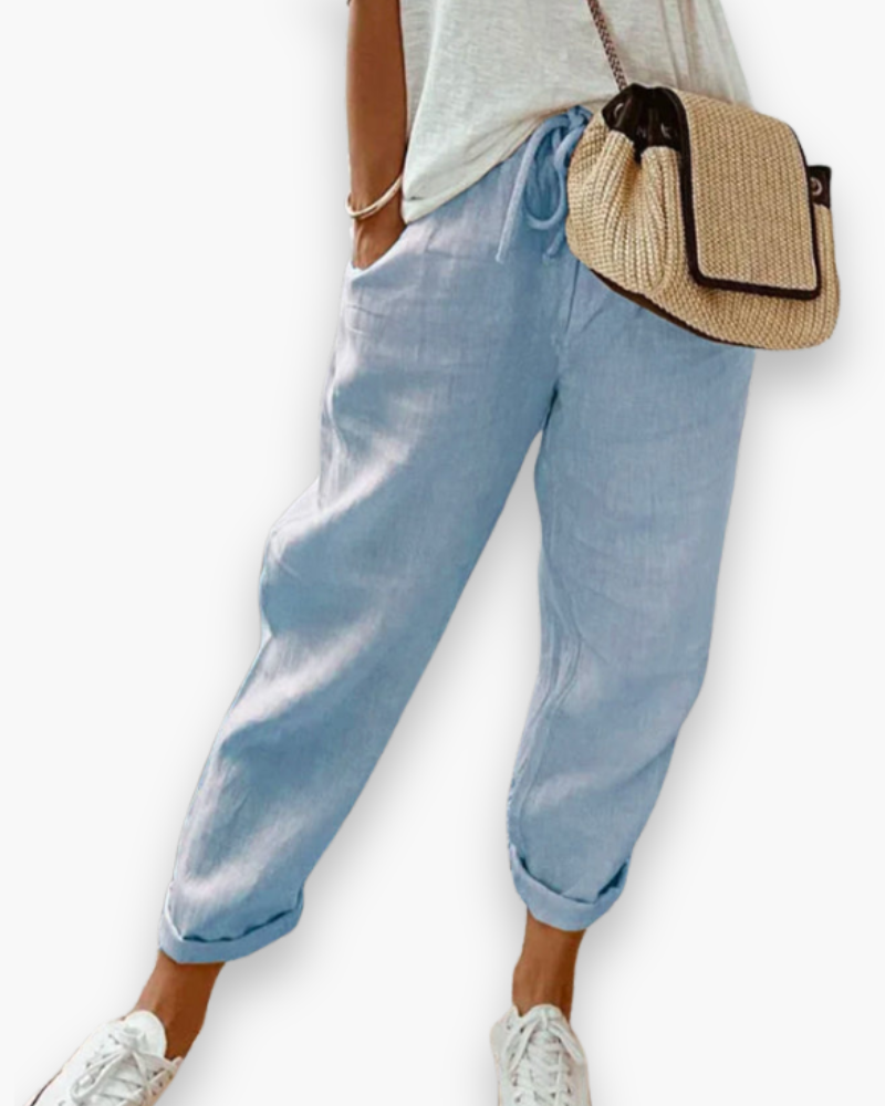 "Pantalon ample femme, tissu léger, style moderne, poches discrètes, taille élastique, coupe élégante, confort optimal"