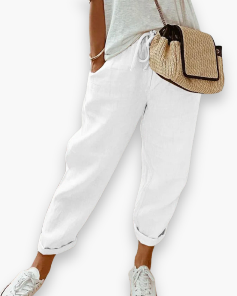 "Pantalon ample femme, tissu léger, style moderne, poches discrètes, taille élastique, coupe élégante, confort optimal"