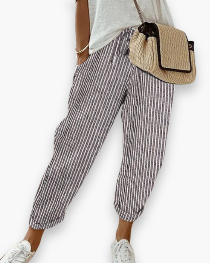 "Pantalon ample femme, tissu léger, style moderne, poches discrètes, taille élastique, coupe élégante, confort optimal"