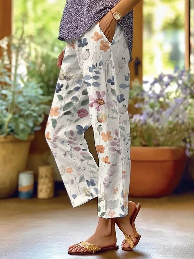 Pantalon décontracté ample femme, motif fleuri vibrant, ample et confortable, idéal pour style estival et chic.