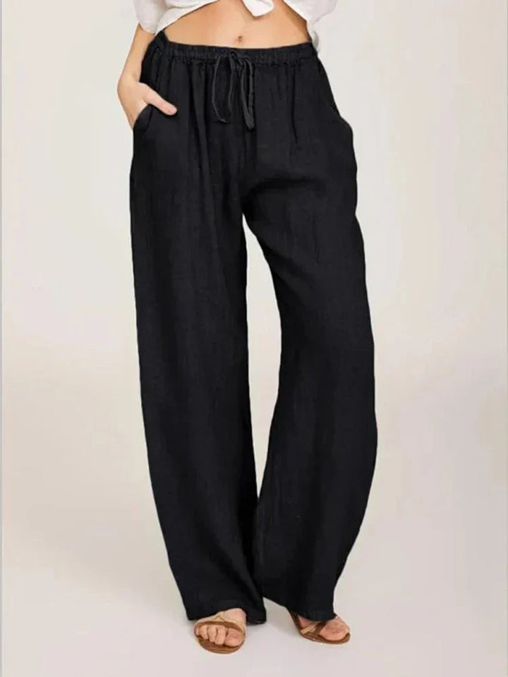 Pantalon femme élégant en lin et coton, coupe féminine, couleur noire, confort chic pour une allure raffinée.