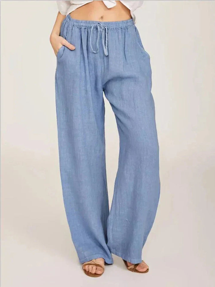 Pantalon femme élégant en lin et coton, coupe féminine, couleur noire, confort chic pour une allure raffinée.