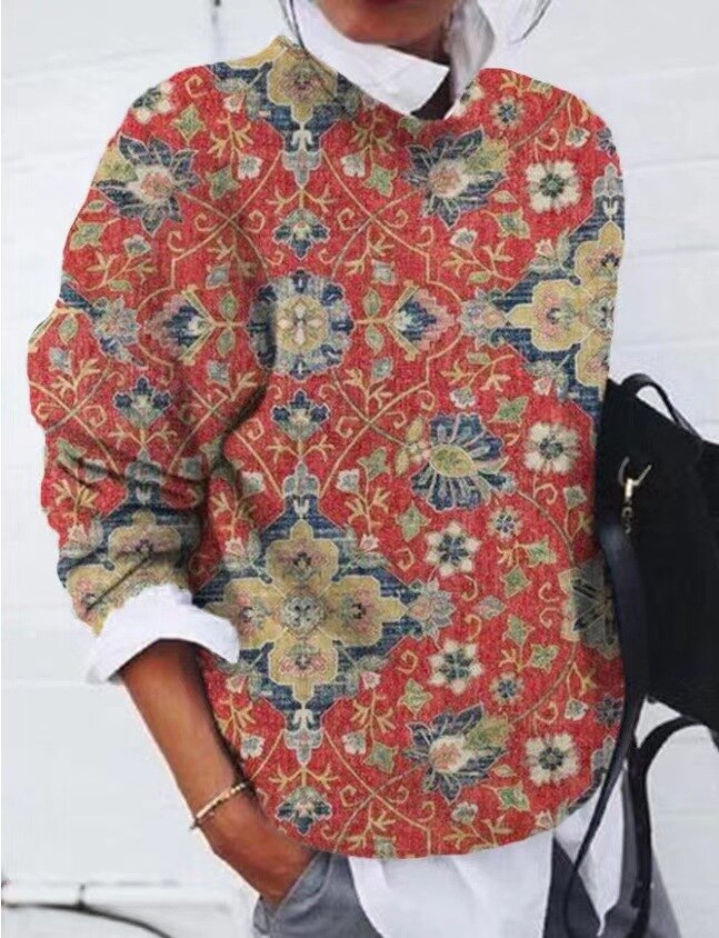 "Pull chic naturel avec motif floral délicat, coton mélangé, coupe flatteuse, idéal pour élégance quotidienne féminine."