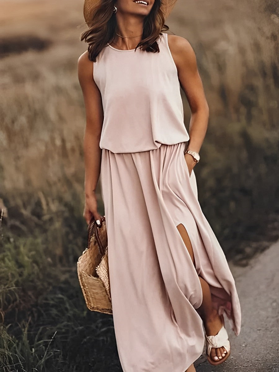 "Robe maxi JONNA sans manches, élégante et colorée, style rétro, tissu léger et fluide pour un look sophistiqué."