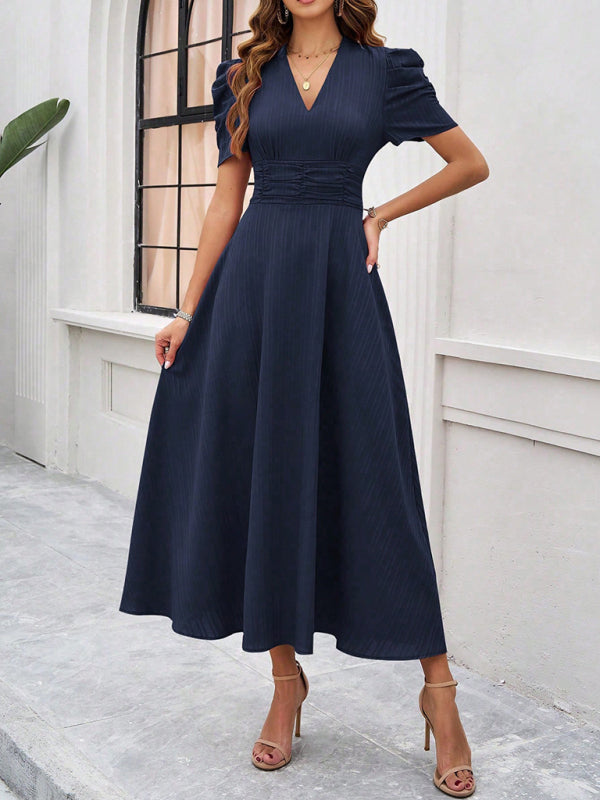 Robe midi évasée élégante avec taille cintrée, manches bouffantes, col V, idéale pour occasions spéciales.