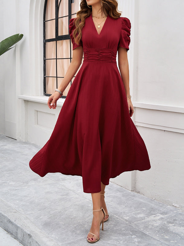 Robe midi évasée élégante avec taille cintrée, manches bouffantes, col V, idéale pour occasions spéciales.