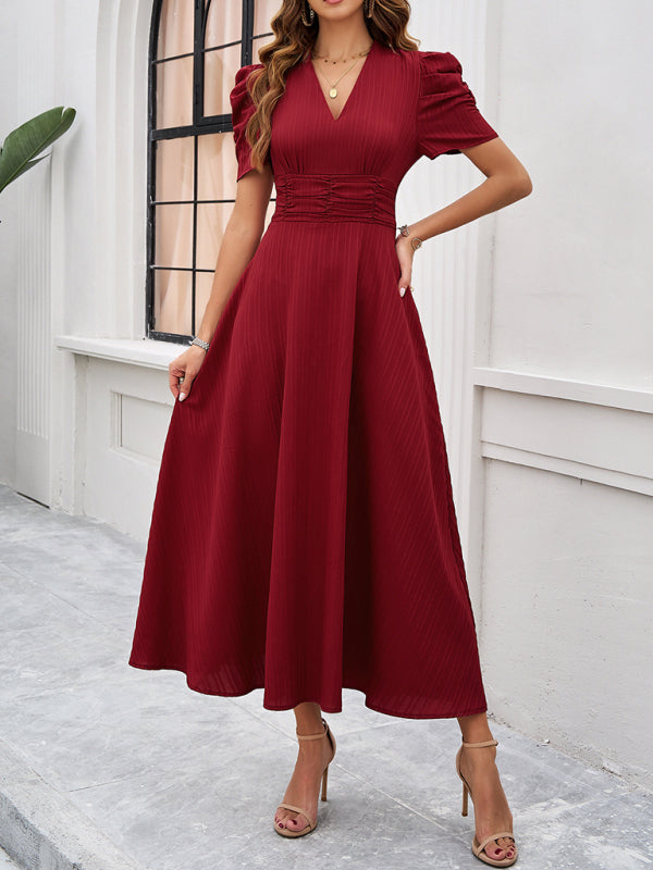 Robe midi évasée élégante avec taille cintrée, manches bouffantes, col V, idéale pour occasions spéciales.