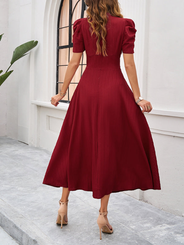Robe midi évasée élégante avec taille cintrée, manches bouffantes, col V, idéale pour occasions spéciales.