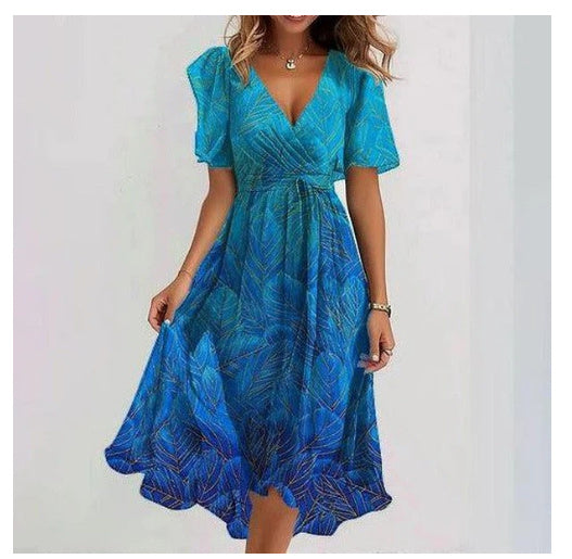 "Robe midi fleurie en chiffon léger, col V plongeant, motifs floraux délicats, idéale pour été."