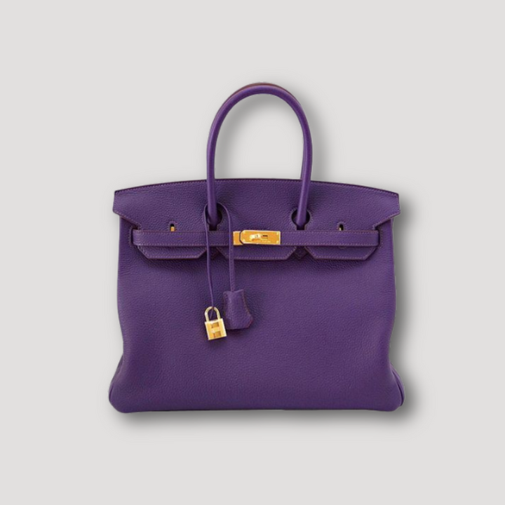 "Sac à main en cuir luxueux, marron, avec design élégant, poignées confortables, et grande capacité"