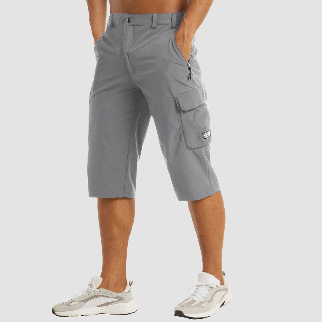 "Short cargo homme séchage rapide, multiples poches, design moderne et pratique, idéal aventure été."