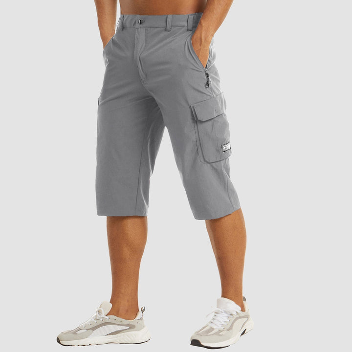"Short cargo homme séchage rapide, multiples poches, design moderne et pratique, idéal aventure été."