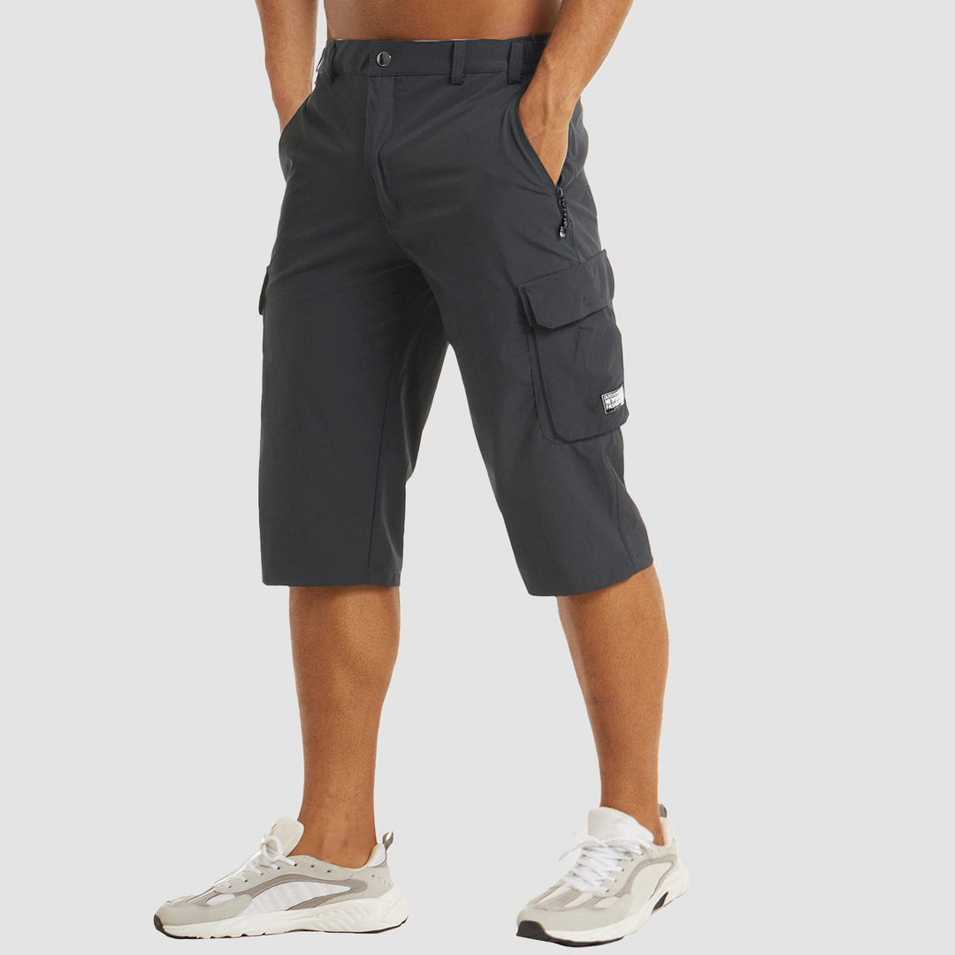 "Short cargo homme séchage rapide, multiples poches, design moderne et pratique, idéal aventure été."