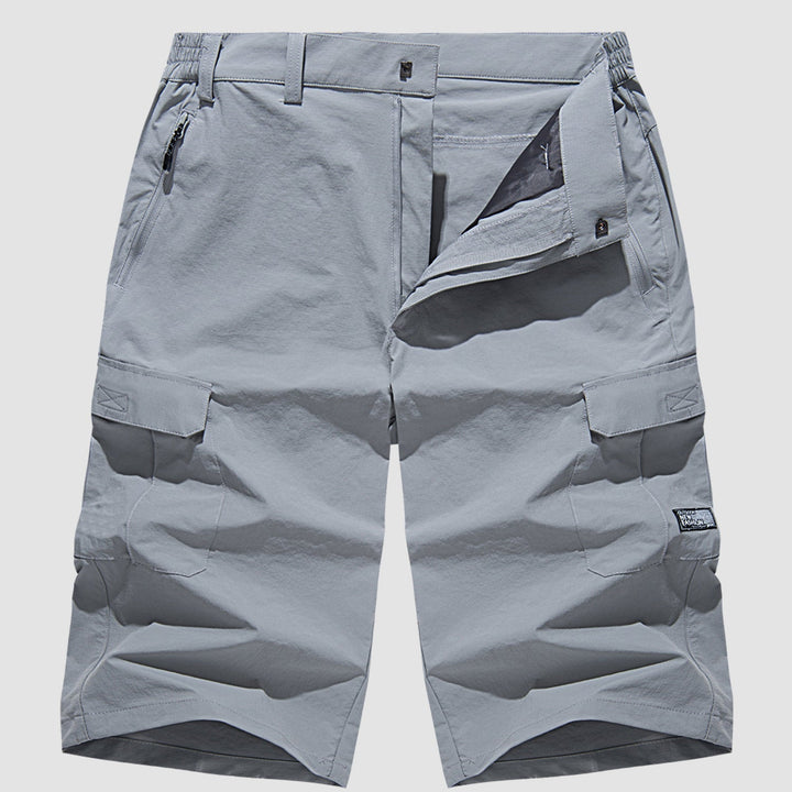 "Short cargo homme séchage rapide, multiples poches, design moderne et pratique, idéal aventure été."