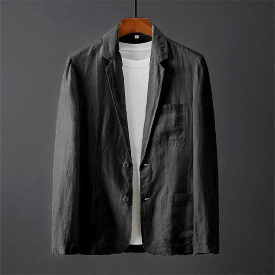 "Veste blazer homme moderne en laine mélangée, coupe ajustée, poches passepoilées et revers cranté."