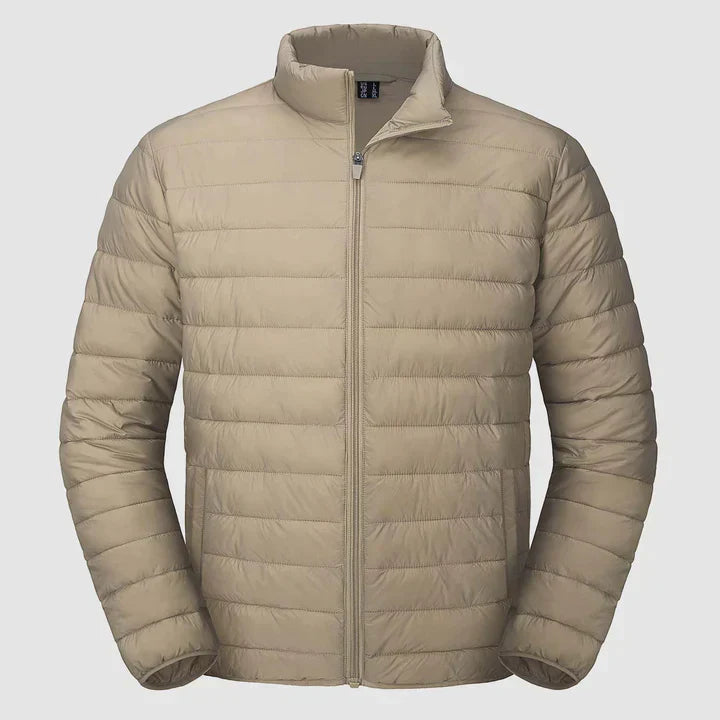 Veste d'hiver matelassée pour homme en noir, coupe moderne, col montant, isolation thermique pour un confort optimal.
