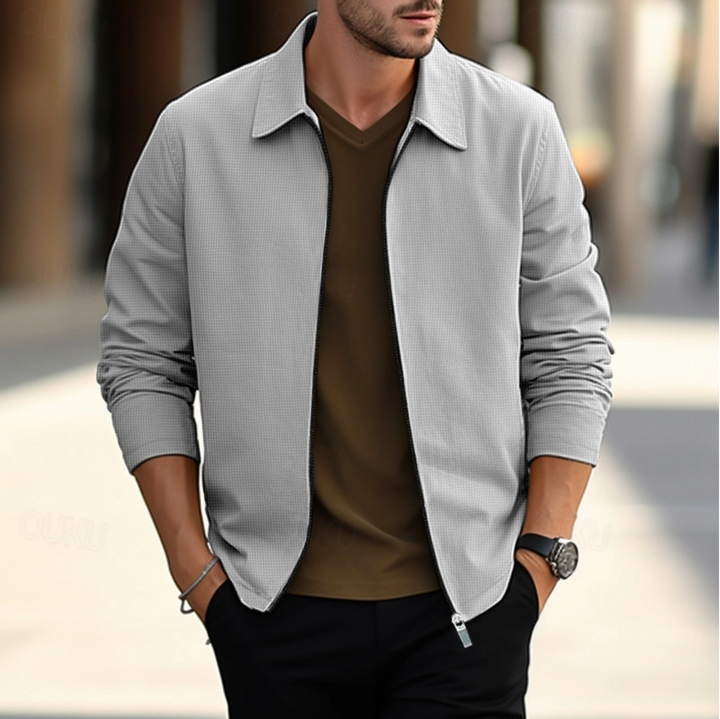 Veste élégante homme en tissu de qualité, couleurs variées, adaptée pour travail ou détente, alliant confort et style.