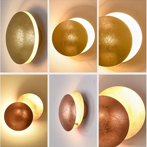 "Applique murale LED moderne, design éclipse scandinave, structure cuivre, finition laiton doré, lumière douce."