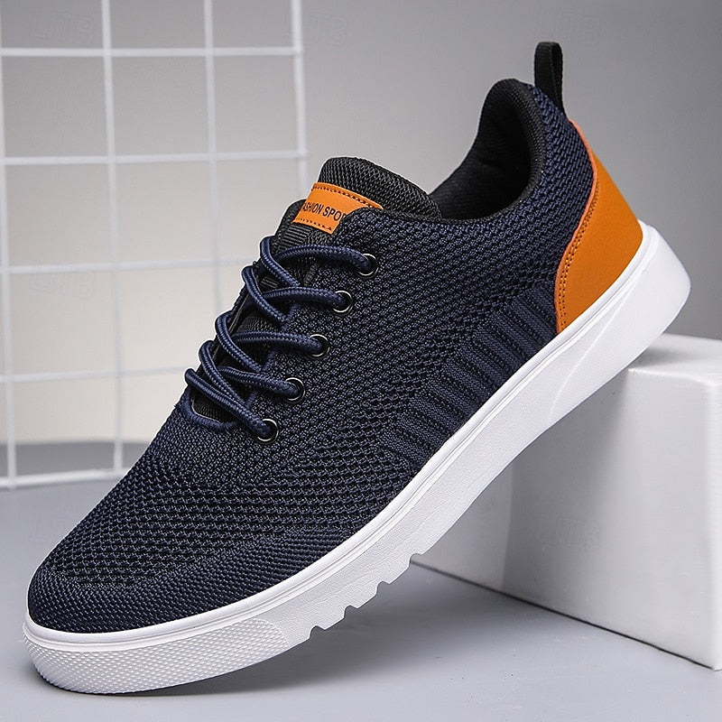"Baskets Julien pour homme, design moderne et respirant, légères, en tissu gris, semelle blanche, style décontracté."