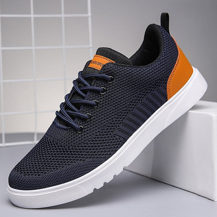 "Baskets Julien pour homme, design moderne et respirant, légères, en tissu gris, semelle blanche, style décontracté."