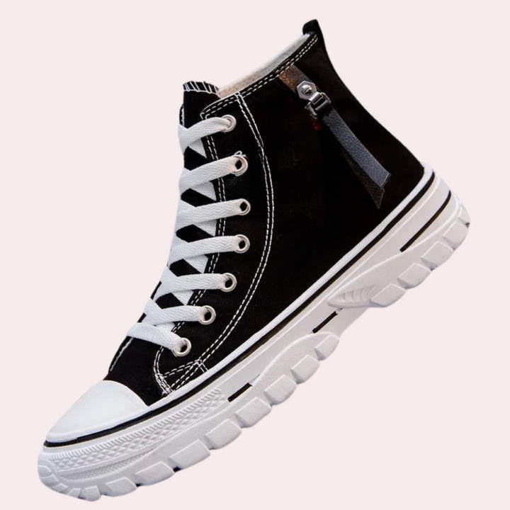 Baskets montantes homme modernes et élégantes en toile noire avec semelle rembourrée pour confort et style.