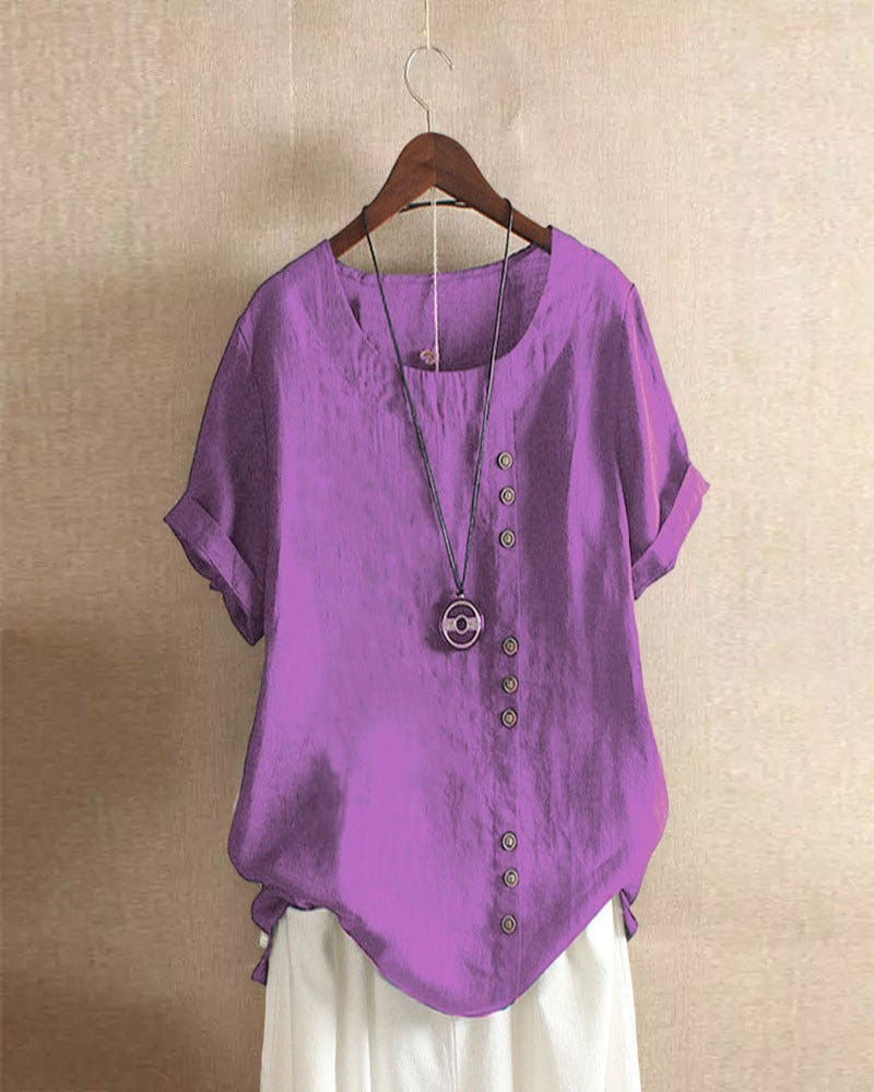 Blouse chic à manches courtes, col rond, en coton doux. Élégante et confortable, idéale pour toutes les occasions.