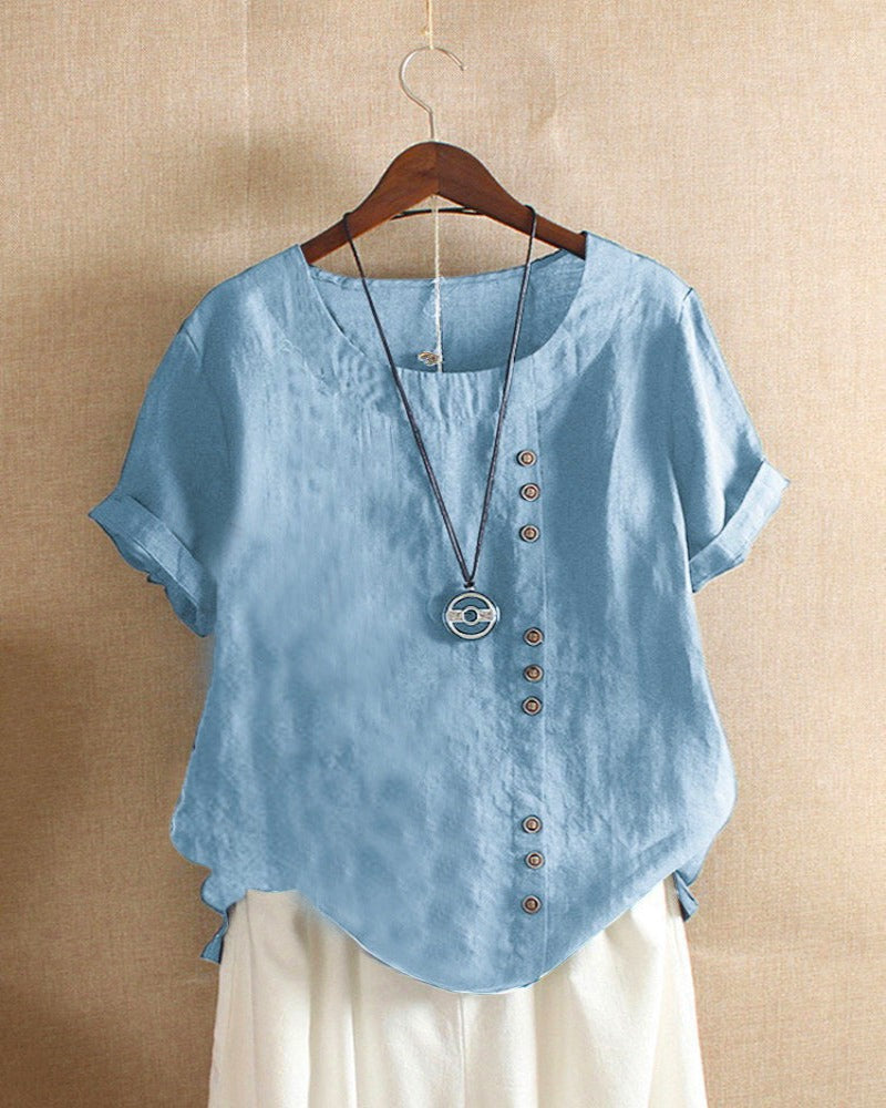 Blouse chic à manches courtes, col rond, en coton doux. Élégante et confortable, idéale pour toutes les occasions.