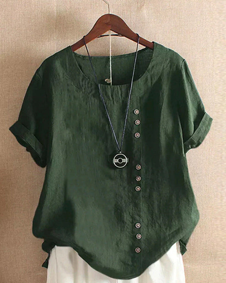 Blouse chic à manches courtes, col rond, en coton doux. Élégante et confortable, idéale pour toutes les occasions.