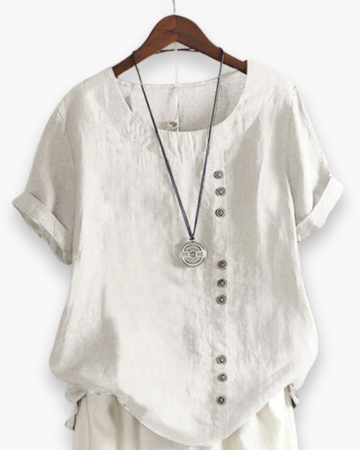 Blouse d'été décontractée, légère et boutonnée, pour femme, chic, avec tissu fluide et détails raffinés.