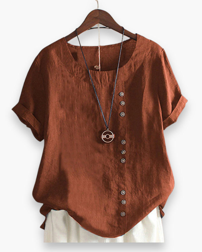 Blouse d'été décontractée, légère et boutonnée, pour femme, chic, avec tissu fluide et détails raffinés.