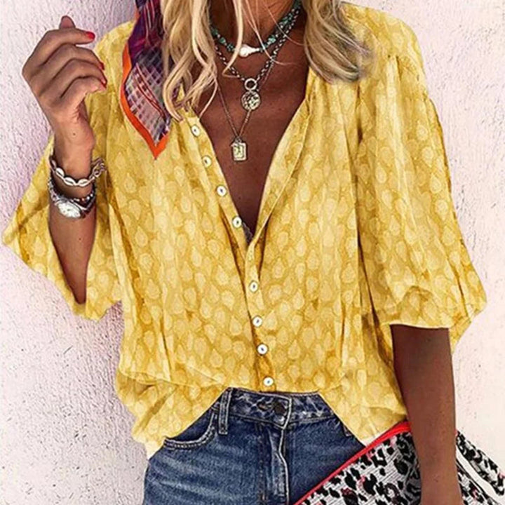 Blouse d'été femme légère et élégante, coupe fluide, parfaite pour looks d'été raffinés et confortables.