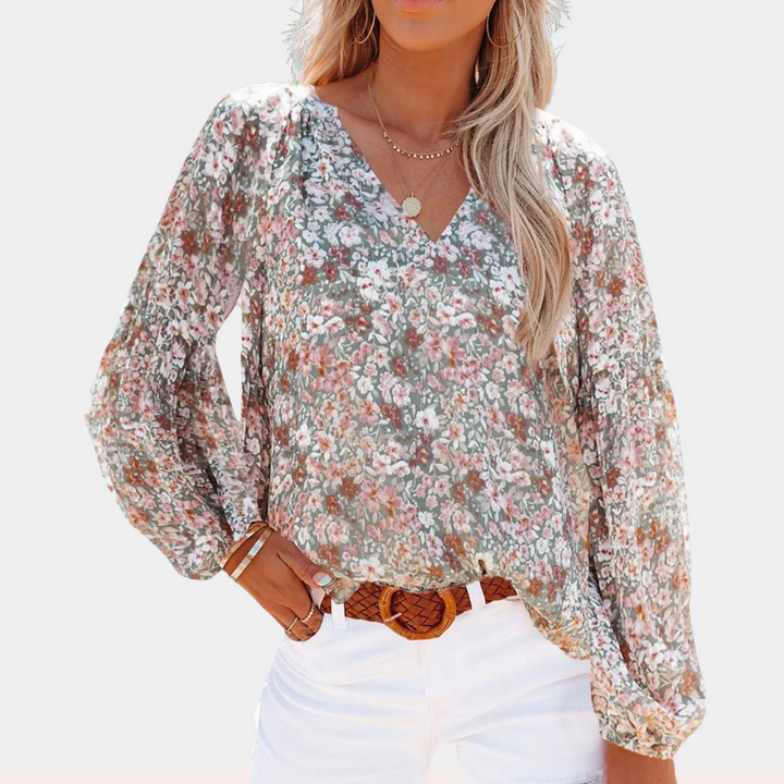 Blouse d'été imprimé floral femme, blanc élégant, tissu léger, pour un style chic et confortable par temps ensoleillé.