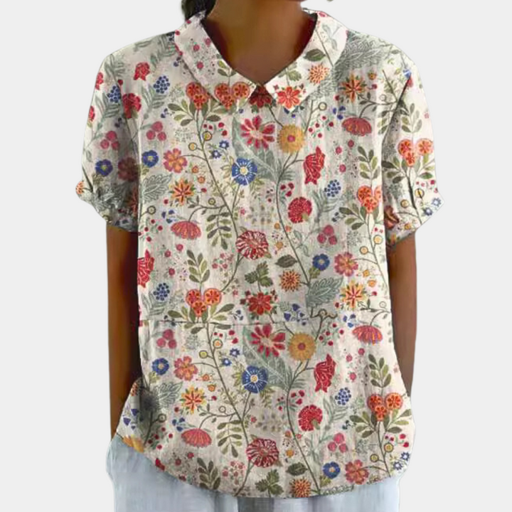 Blouse femme, imprimé fleuri pastel, col rond, couleur verte. Élégante et confortable, idéale pour un style décontracté.