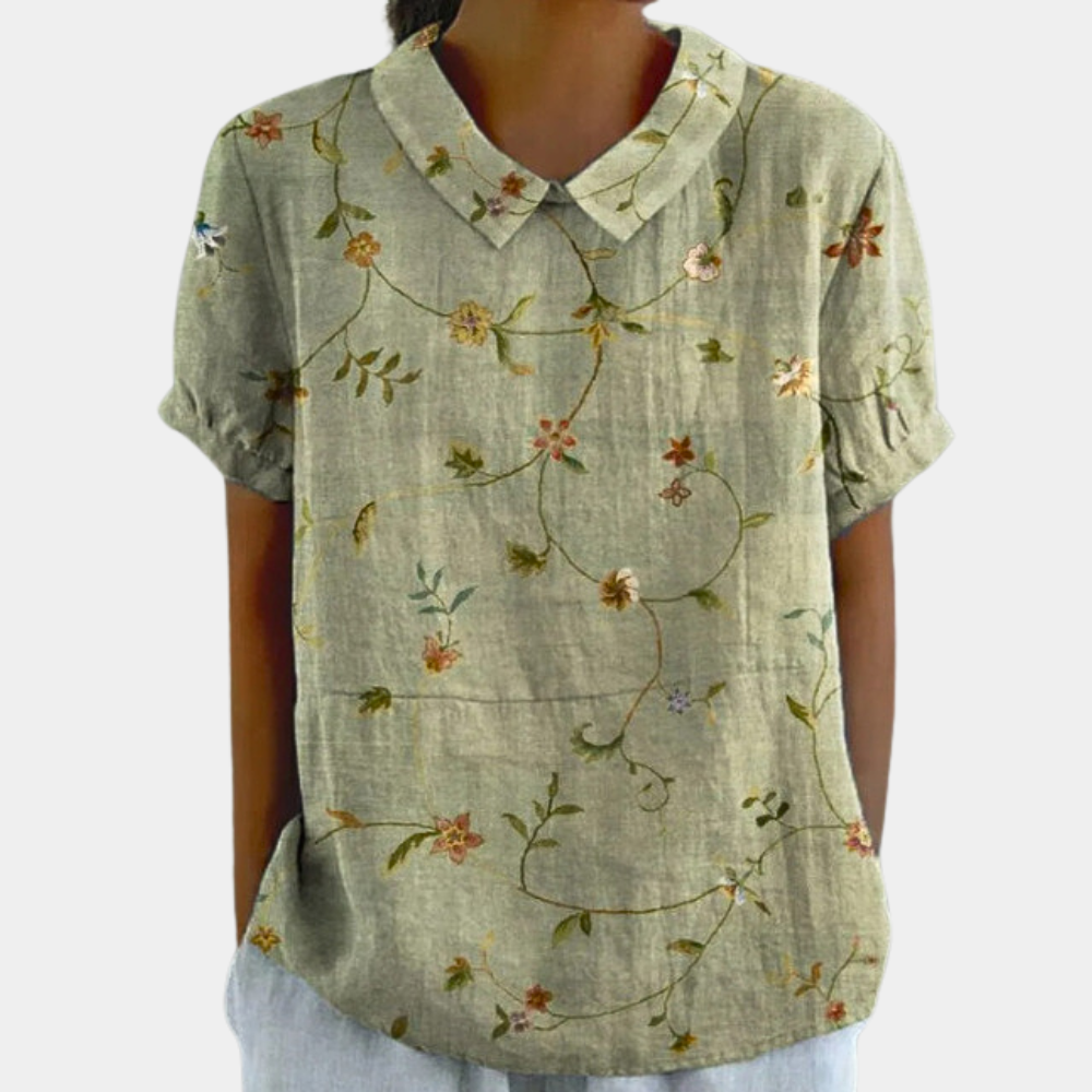 Blouse femme, imprimé fleuri pastel, col rond, couleur verte. Élégante et confortable, idéale pour un style décontracté.