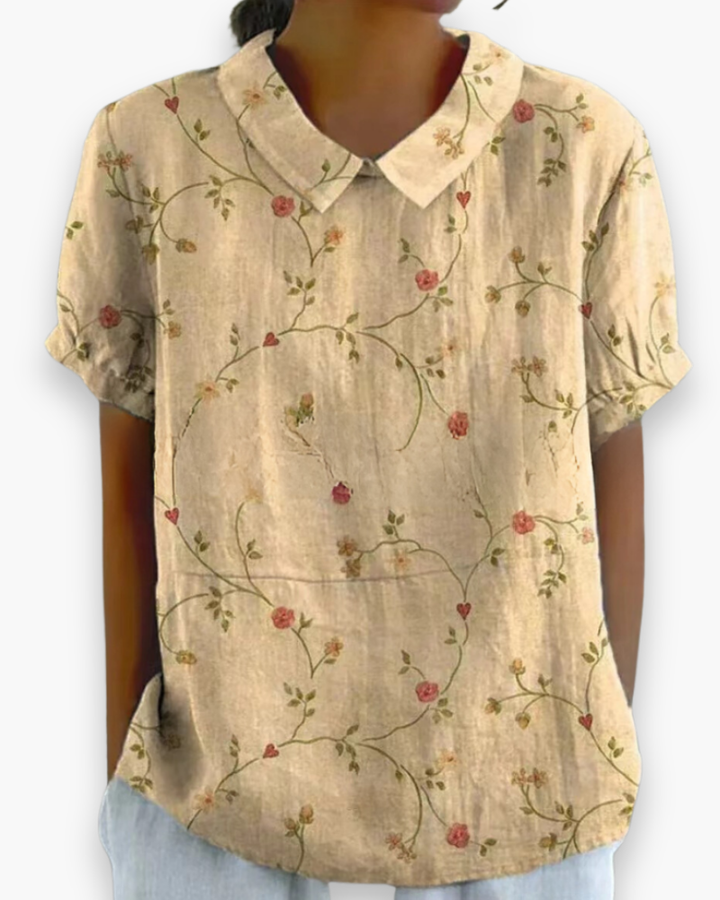 "Blouse florale décontractée femme, vue avant, coupe ample, imprimé fleuri coloré, tissu léger parfait pour l'été."