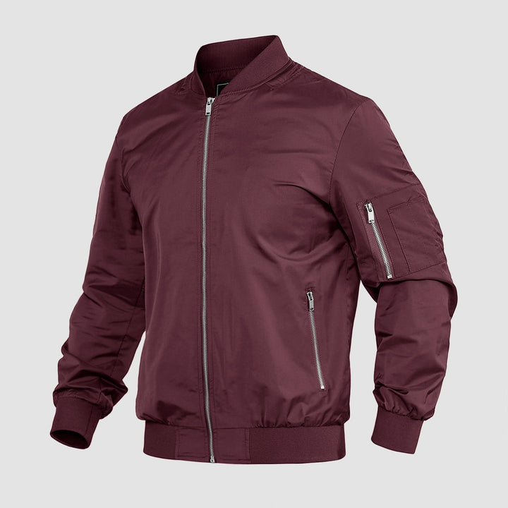 "Blouson bomber léger homme printanier, fermeture éclair, coupe moderne, tissu respirant, couleur bleu royal vibrant."