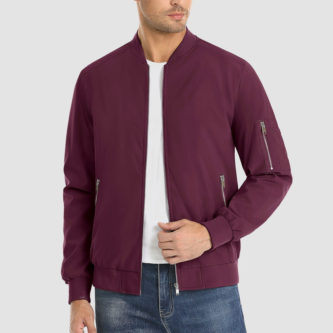 "Blouson bomber léger homme printanier, fermeture éclair, coupe moderne, tissu respirant, couleur bleu royal vibrant."