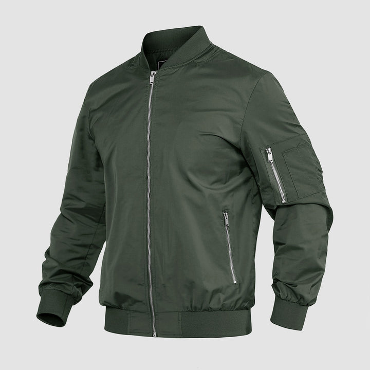 "Blouson bomber léger homme printanier, fermeture éclair, coupe moderne, tissu respirant, couleur bleu royal vibrant."