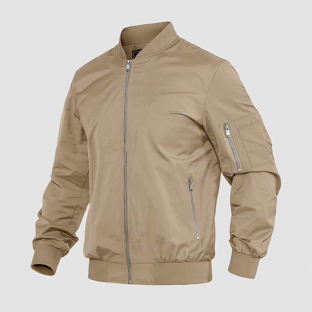 "Blouson bomber léger homme printanier, fermeture éclair, coupe moderne, tissu respirant, couleur bleu royal vibrant."