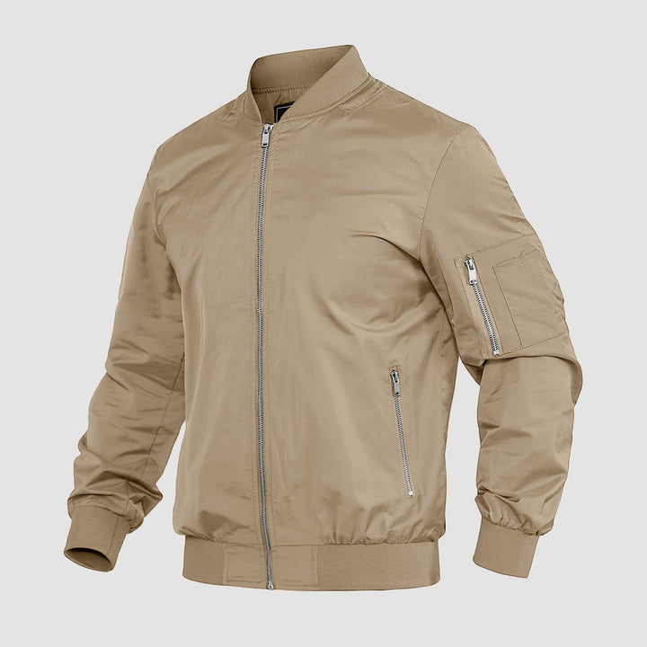 "Blouson bomber léger homme printanier, fermeture éclair, coupe moderne, tissu respirant, couleur bleu royal vibrant."